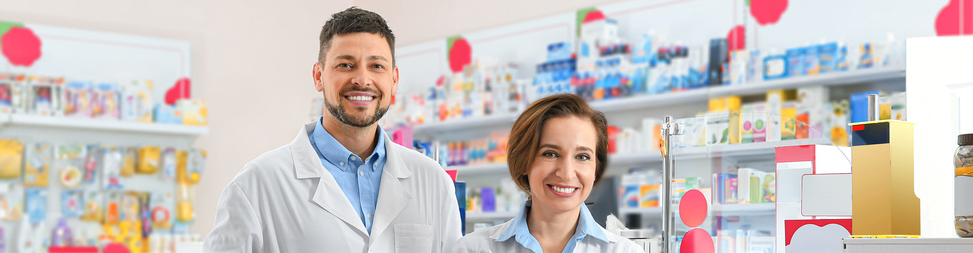 pharmacy's staffs smiling in front of the camera